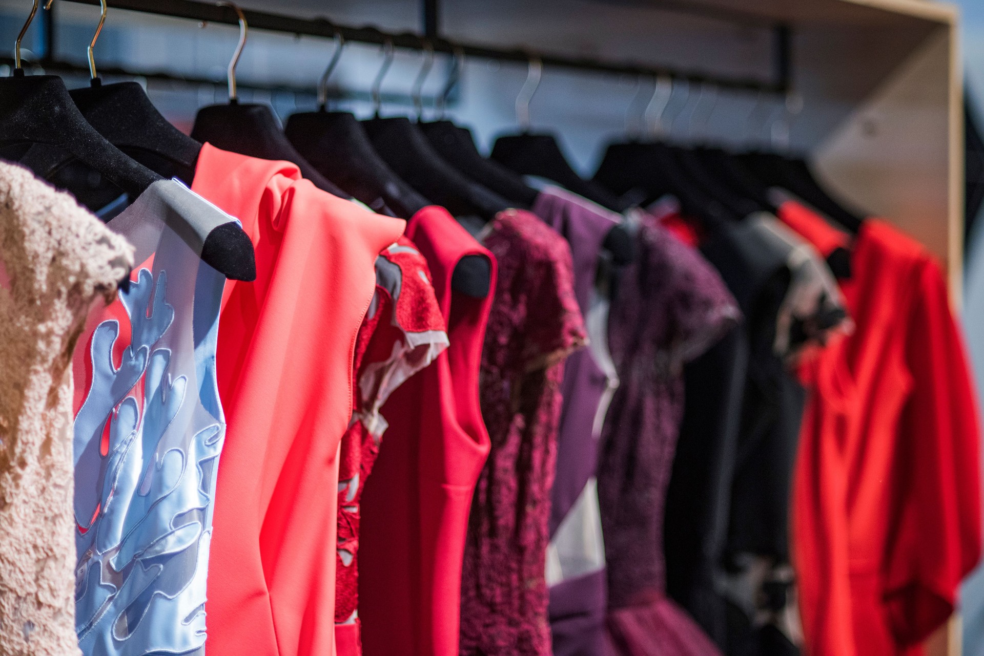 Elegant and luxury dresses in detail in a boutique store.